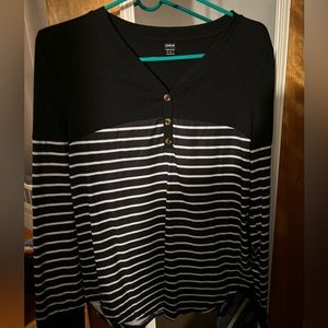 Women’s black and white striped shirt.